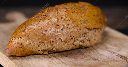 a healthy loaf of soft bread with added seeds and bran