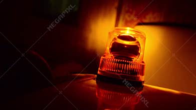 Flashing beacon. Orange rotating light.