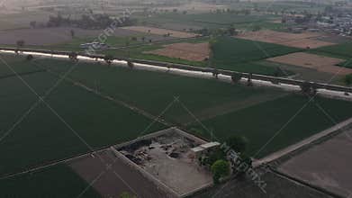 Erial view of agricultural fields and road infrastructure in Chichawatni Pakistan rural landscape