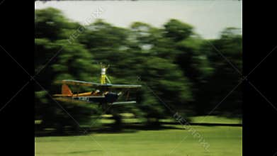 Vintage biplane aerobatics in uk countryside