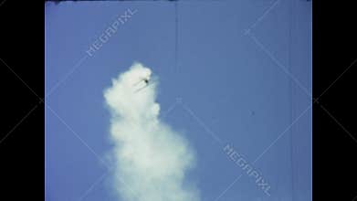 Vintage biplanes performing aerobatics in the uk sky