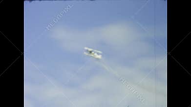 Vintage biplanes performing aerobatics in the uk sky