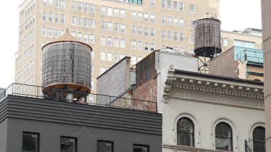New York City building architecture. Residential house exterior. USA real estate. Rooftop water tower