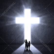 Family walks towards a Cross
