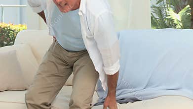 Retired man having a back pain