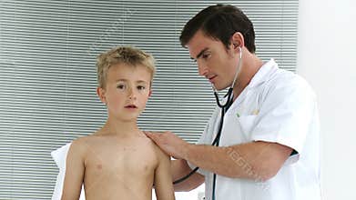 Doctor listening to a child with stethoscope