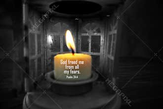 Bible verse quote on a candle light - God freed me from all my fears. Psalm 34:4 with old lantern in the night onndark background
