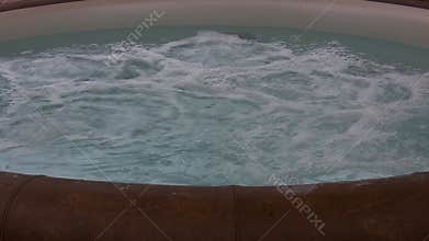 Bath tub full of bubbling water