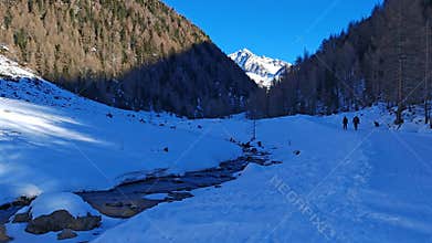 Winter trekking in Riva di Tures with snow during sunnyday of January