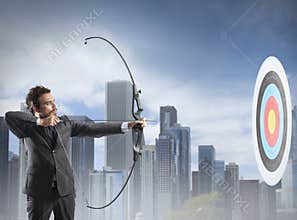 Businessman with bow and arrow