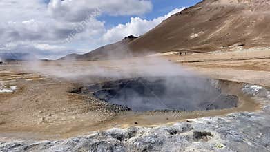 geothermal area Namafjall with mud pot fuming and boiling