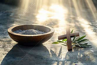 Religion, faith, liturgy, Ash Wednesday, Lent background. Brown wooden cross, ceremonial ash bowl and olive branch on