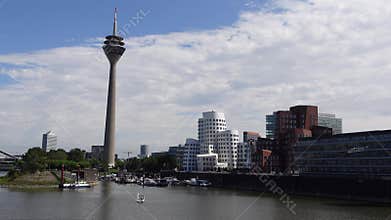 View of Rhine Tower and Neuer Zollhof flat complex from The Living Bridge in Dusseldorf, Germany