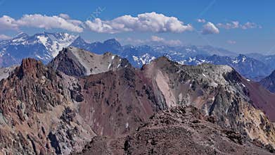 Aerial view of sharp mountain ridges and glaciers in the Andes