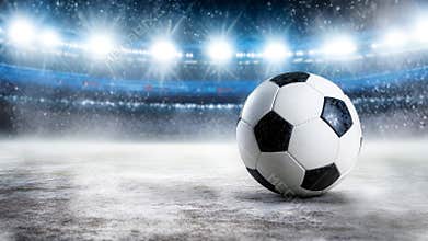 A soccer ball is sitting on a field