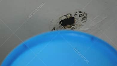 Close up water damaged ceiling with rain