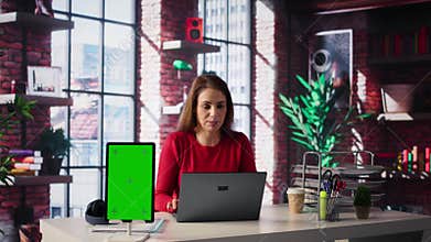 Woman organizing and planning activities on the agenda next to chroma key