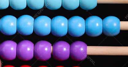 colorful wooden beads on abacus for children's play