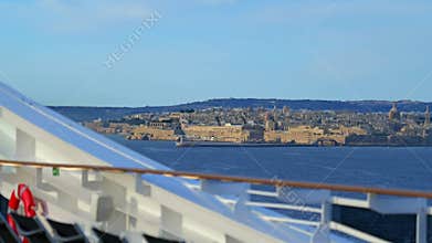 Slow-motion cruise ship arrival at Valletta, Malta, with historic skyline in view