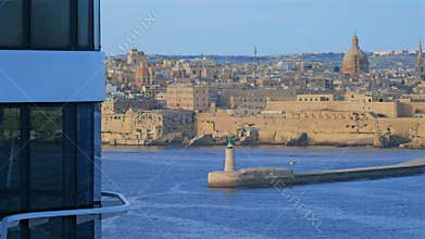 Slow-motion view of Valletta, Malta, with St. Paul's Cathedral and historic fortifications