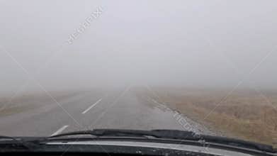Fog in a mountain landscape during a foggy morning.