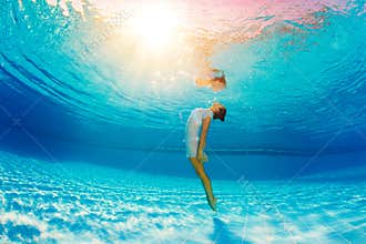 Underwater swimming and reflection in water