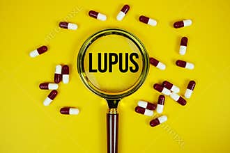 Lupus text on sticky note paper with Medicine and Magnifying glass on yellow background