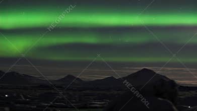 Northern Lights over the frozen Arctic fjord