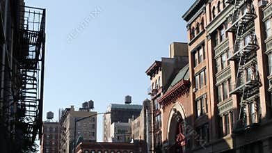 New York City Manhattan architecture, USA. Residential house exterior. Red brick facade, water tower