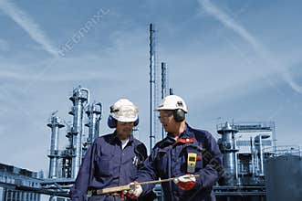 Engineers with oil and gas refinery