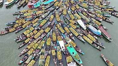 Aerial view of floating market of seasonal fruits on the boats in Kaptai Lake, Rangamati, Bangladesh.
