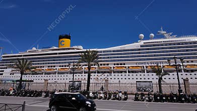 Cruise ship docked in Cadiz, Spain, with scooters parked in the foreground - CADIZ, SPAIN - MARCH 26, 2025