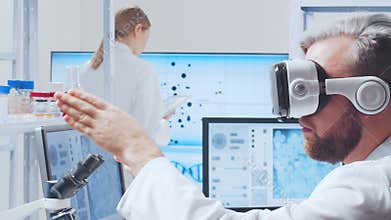 Scientific laboratory filled with various research equipment. Scientists are conducting experiments and research