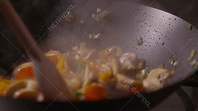 man Woman, hand and cooking in kitchen with aroma, vegetables and stirring food in pan. Chef Nutritionist, culinary skills