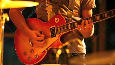 Musician plays the guitar