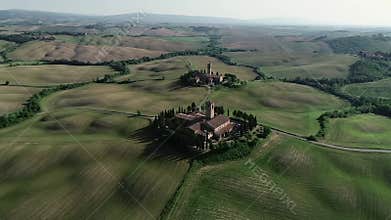 Aerial View of Tuscany\'s Rolling Green Hills with Red Roofed Farmhouses and Lush