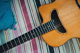 Gypsy jazz acoustic guitar on a colorful blanket