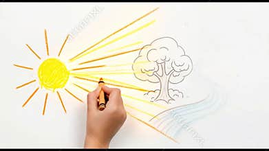 Child\'s Hand Drawing Bright Sun: Crayon Animation of Joyful Creation