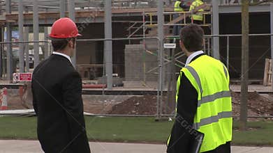 Two engineers in discussion at a Construction Site