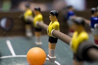 Foosball game yellow team close up