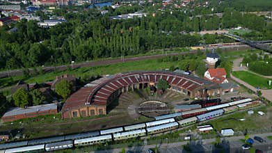 Roundhouse historic locomotive shed, trains. Unique aerial view flight drone