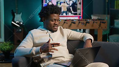 Responsible male adult does his taxes with the credit card at home