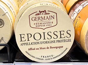 Epoisses cheese wheel with french origin label from fromagerie germain
