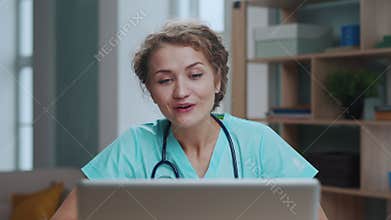Portrait of Woman Doctor Working as Medical and Talking at Video Call on Laptop