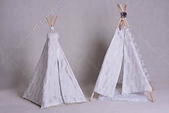 Homemade DIY white and silver pet tents on white background