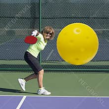 Pickleball Action - Senior Woman Hitting Backhand