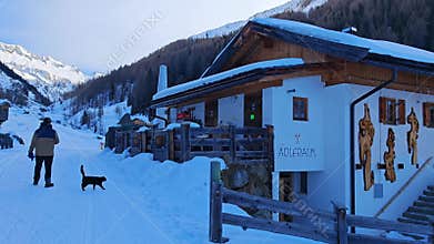 Casere, Italy - January 21, 2025: walking in the center of Casere alpine village with snow in winter season