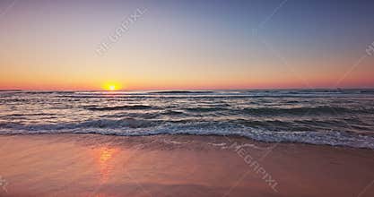 Scenic beautiful sea sunrise on the beach, color tropical ocean shore sunset
