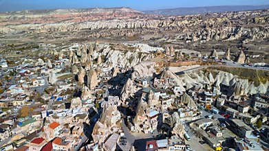 Drone flying over the Ortahisar Castle with huge rocks in Ortahisar, Turkiye during the day