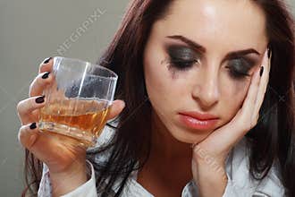 Woman in depression drinking alcohol